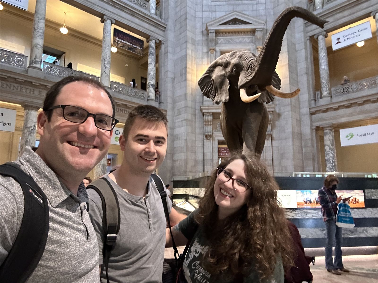 Blue Engine team selfie with the elephant at the Smithsonian Natural History Museum