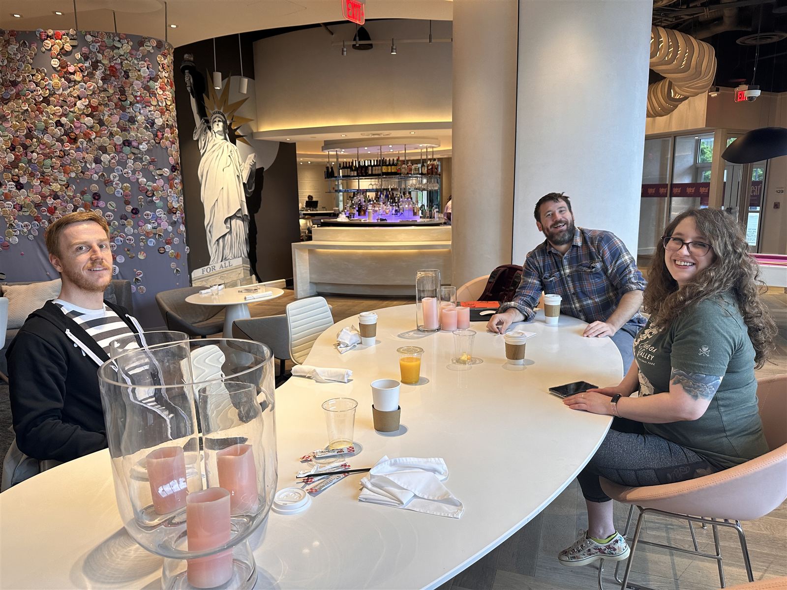 The Blue Engine team talking around a table in a café